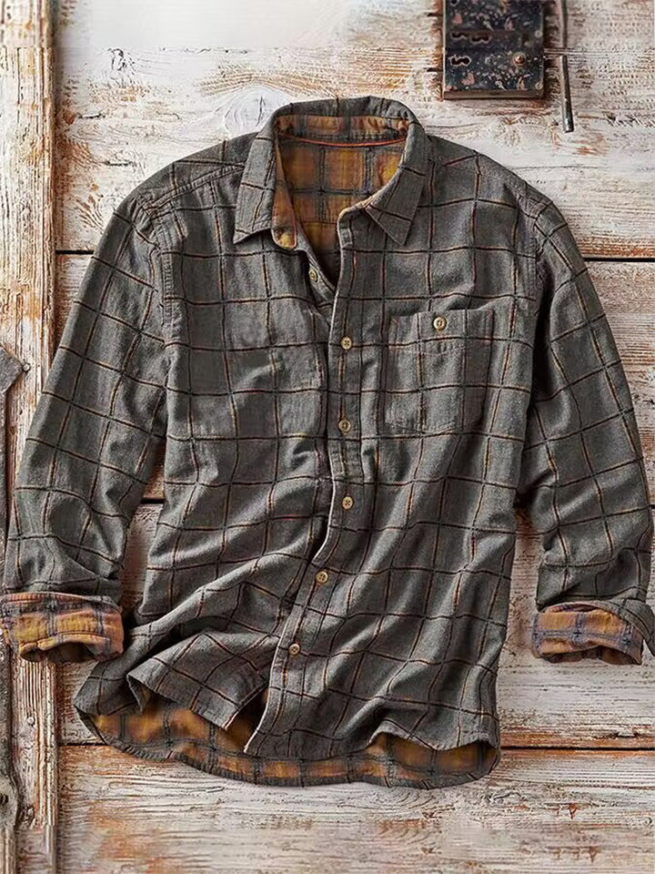 Grijs geruit herenshirt met lange mouw en ruitpatroon. Modieus overshirt met borstzak, perfect voor casual look.