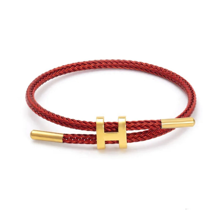 Moderne unisex statement armband; gevlochten design, elegante H-sluiting. Een opvallend sieraad voor jouw pols.