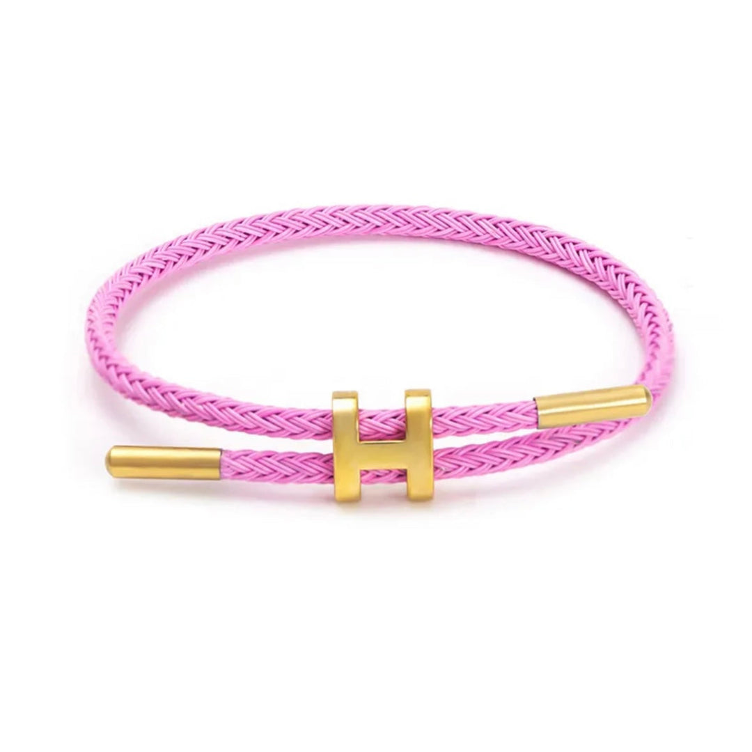 Elegante unisex gevlochten armband met H-sluiting, geschikt voor diverse gelegenheden. Trendy touw sieraad.