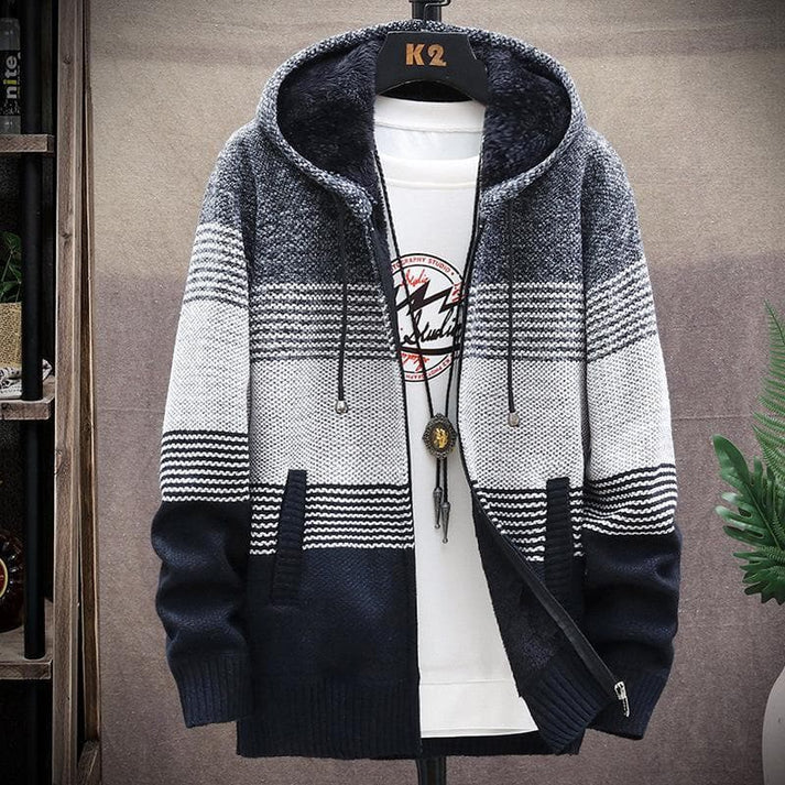 Grijs lang herenvest met capuchon, comfortabel voor wintermode. Casual herenvest met lange pasvorm.
