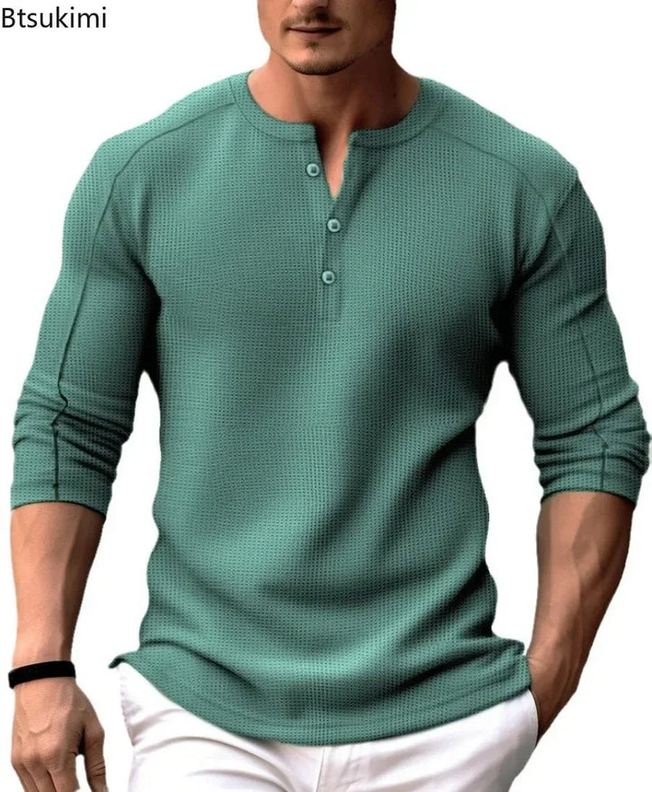 Stijlvol heren sweatshirt met knoopsluiting. Casual mode longsleeve in groen, ideaal voor een smart casual look.