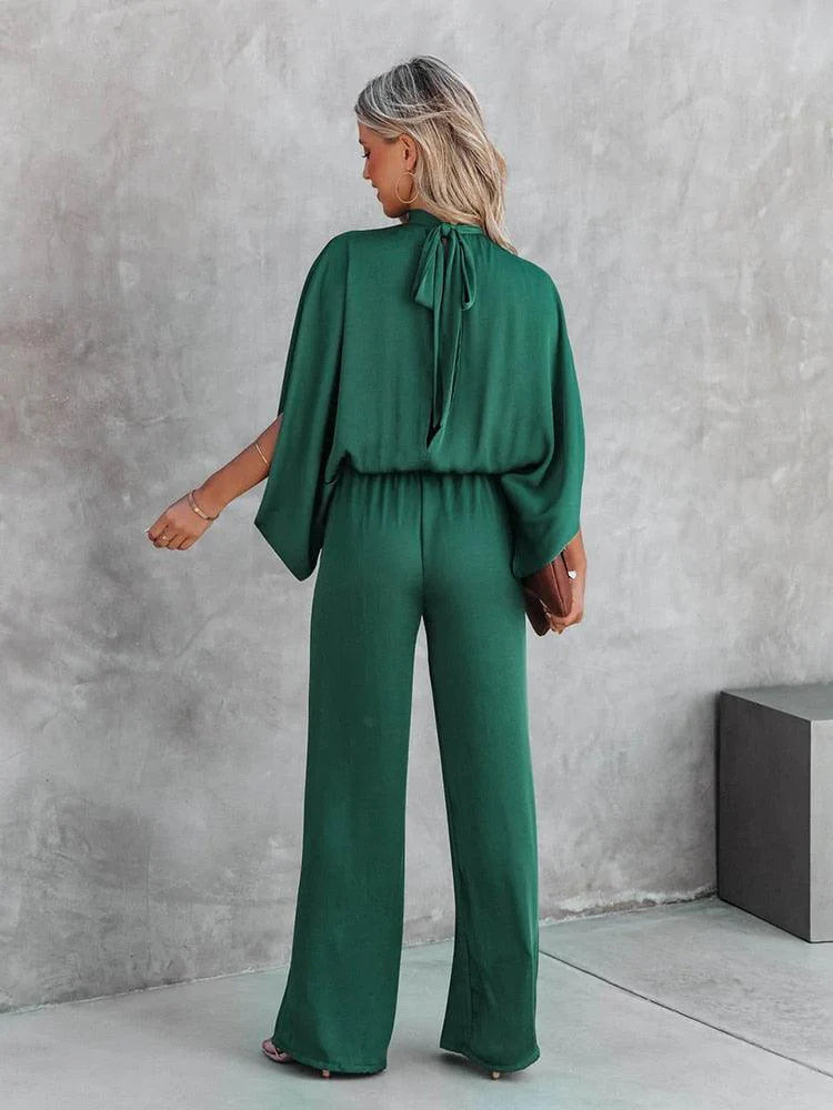 Comfortabele groene jumpsuit voor dames, voorzien van stijlvolle capemouwen en een elegante tailleband.