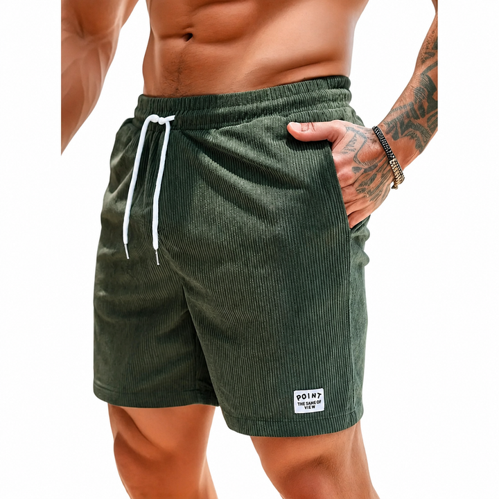 Modieuze groene herenshorts met elastische taille, trekkoord en zijzakken. Casual en comfortabel.