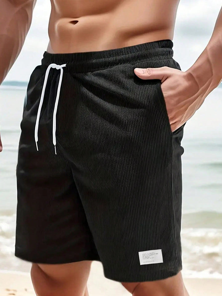 Heren trekkoordshorts in groen, relaxte pasvorm, met handige zakken en comfortabele taille.