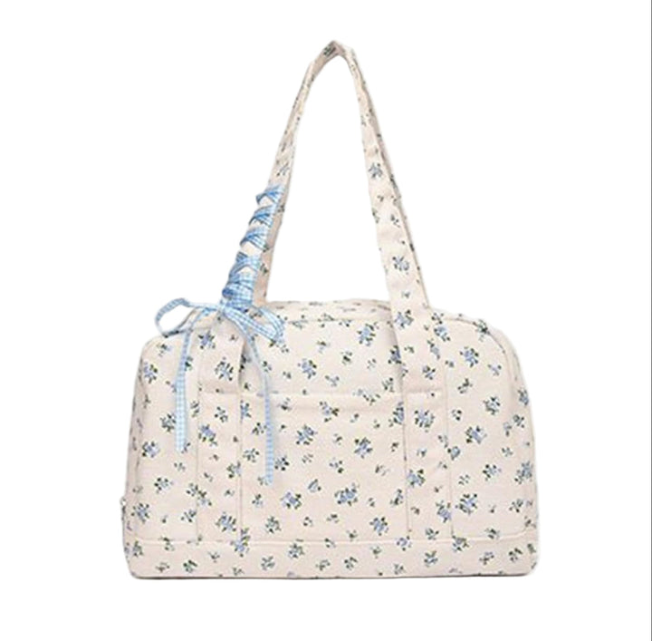 Ideale Floria vakantietas: ruime canvas damestas met strik, perfect voor weekendjes weg of korte reizen.