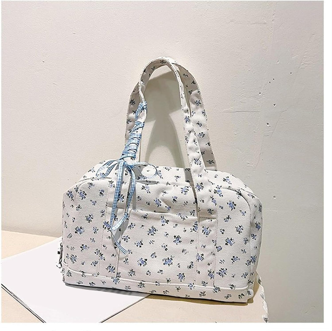 Hoogwaardige canvas Floria duffeltas met strik, stevige damestas perfect als weekendtas of reistas.