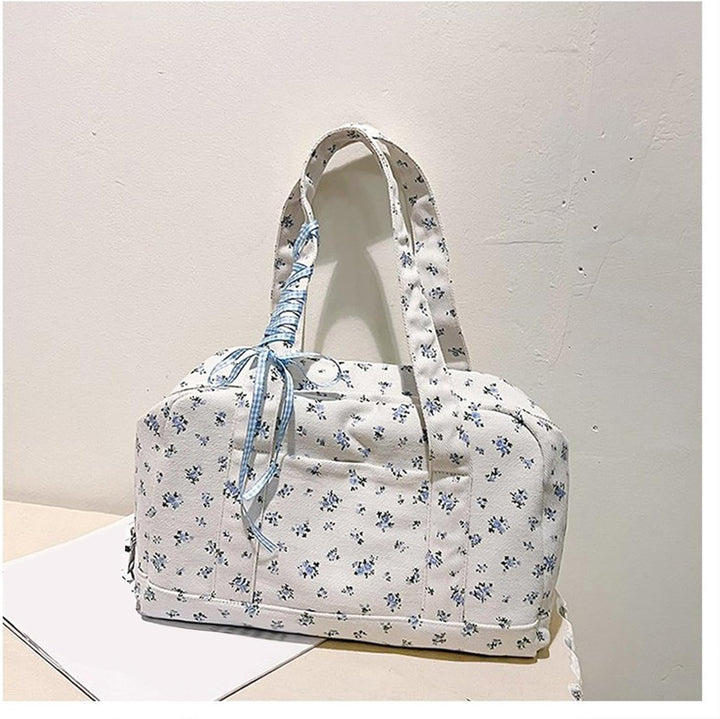 Hoogwaardige canvas Floria duffeltas met strik, stevige damestas perfect als weekendtas of reistas.