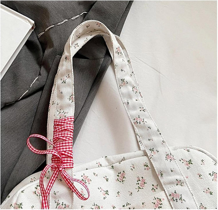Floria damestas: grote canvas weekendtas met opvallende strik, perfect voor korte trips en reis accessoires.