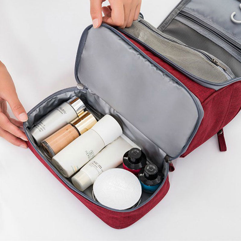 Multifunctionele hangende reistas voor toiletartikelen, met handige vakken en robuuste ritsen. Perfect voor georganiseerd reizen.