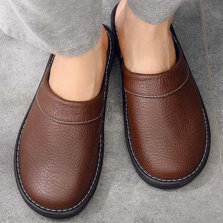 Heren leren pantoffels van hoogwaardig leder met zachte voering en duurzame zool, stijlvol ergonomisch ontwerp voor comfort.