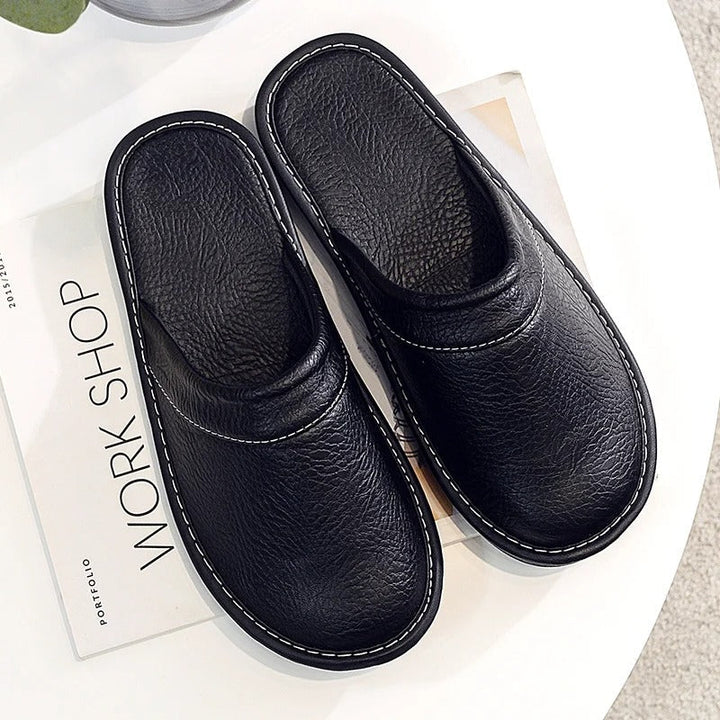 Heren leren pantoffels van hoogwaardig leder met zachte voering en duurzame zool, stijlvol ergonomisch ontwerp voor comfort.