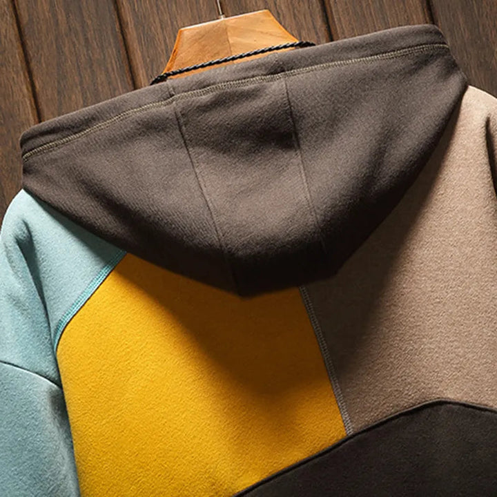 Warme heren loose-fit hoodie met praktische capuchon, perfect voor ontspannen momenten thuis of buiten.
