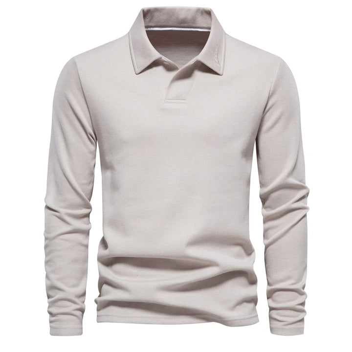 Heren poloshirt met lange mouwen en klassieke kraag, ideaal voor casual en smart casual herfststijl.