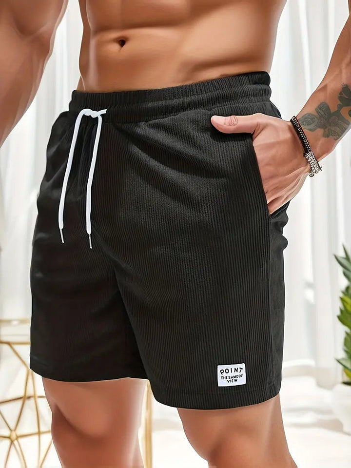 Strandklare heren shorts: comfortabel, met trekkoord en zakken, perfect voor zomerse avonturen.