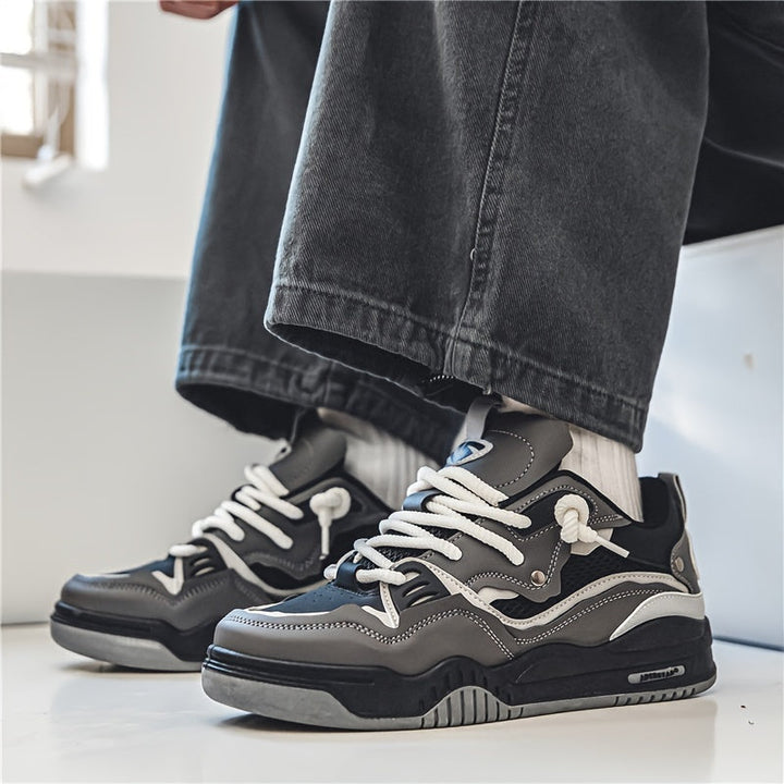 Sportieve herensneakers met dynamisch patroon, bieden ademend comfort en een trendy uitstraling.