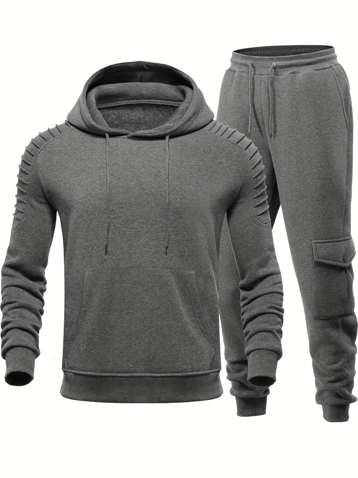 Sportieve heren fitness kleding set, bestaande uit trui met lange mouwen en passende joggingsbroek.