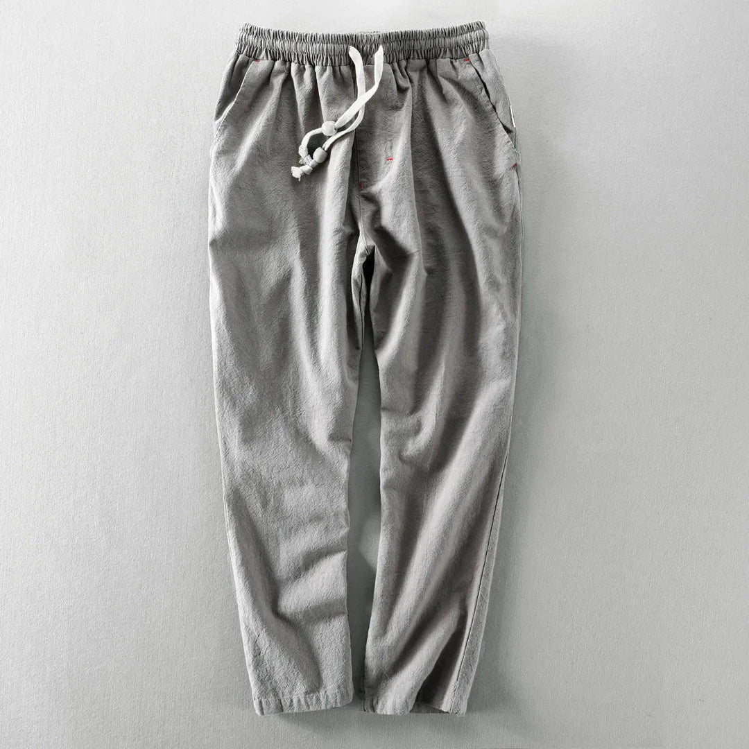 Close-up textuur van de casual herenbroek met rechte pijp, comfortabele elastische taille en trekkoord.