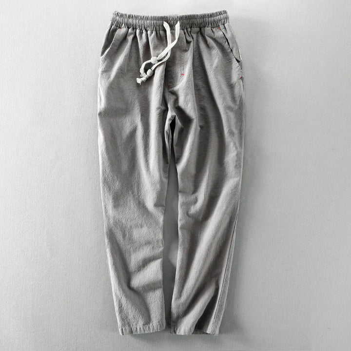 Close-up textuur van de casual herenbroek met rechte pijp, comfortabele elastische taille en trekkoord.