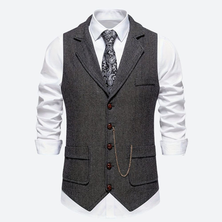 Klassiek herengilet met visgraatmotief, stijlvol en tijdloos, ideaal voor formele en zakelijke gelegenheden.