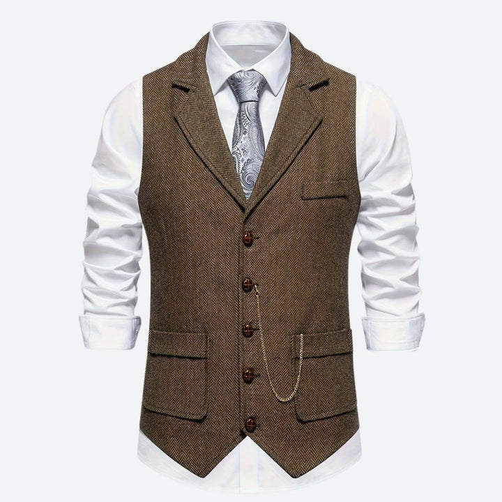 Klassiek herengilet met visgraatmotief, stijlvol en tijdloos, ideaal voor formele en zakelijke gelegenheden.