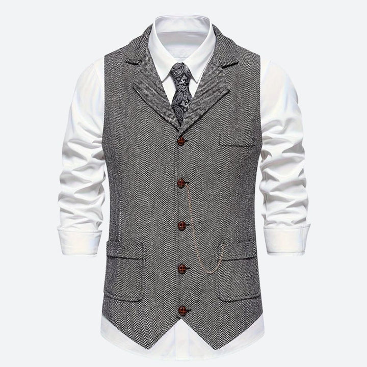 Klassiek herengilet met visgraatmotief, stijlvol en tijdloos, ideaal voor formele en zakelijke gelegenheden.