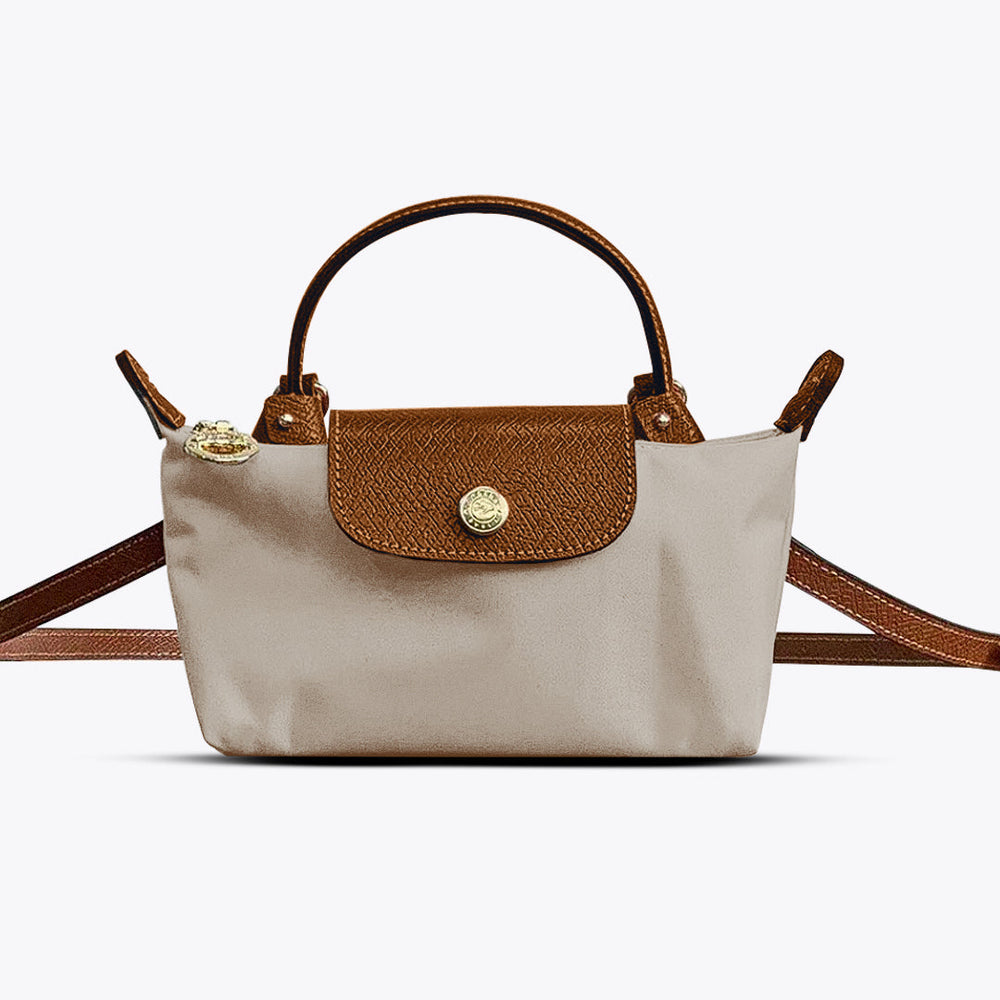 Stijlvolle beige mini crossbody tas voor dames, compact & functioneel, ideaal voor een modieuze look.