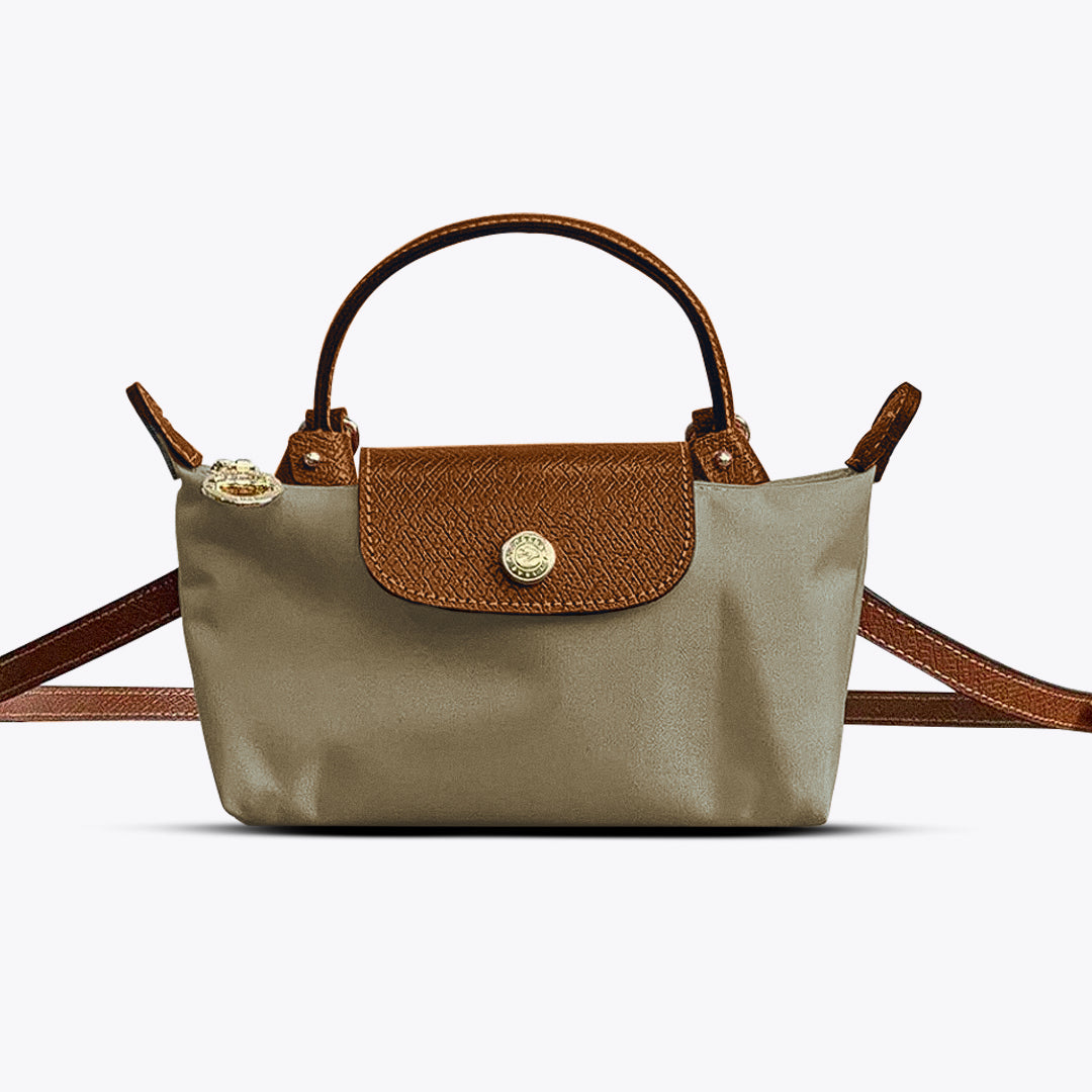 Modieuze dames kruistas in khaki gedragen als crossbody, perfect voor een casual of zakelijke outfit.