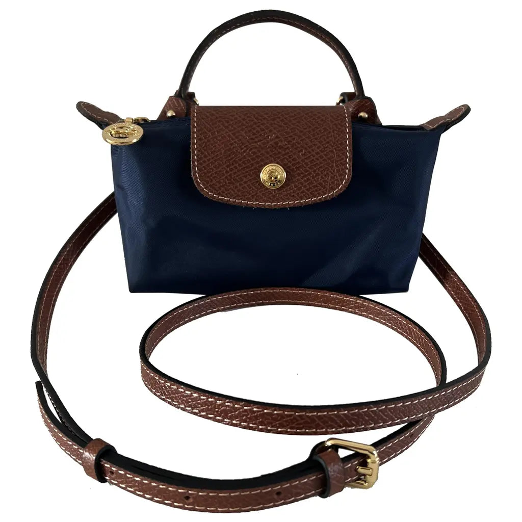 Compacte zwarte dames kruistas met verstelbare schouderband, ideaal als kleine elegante schoudertas.