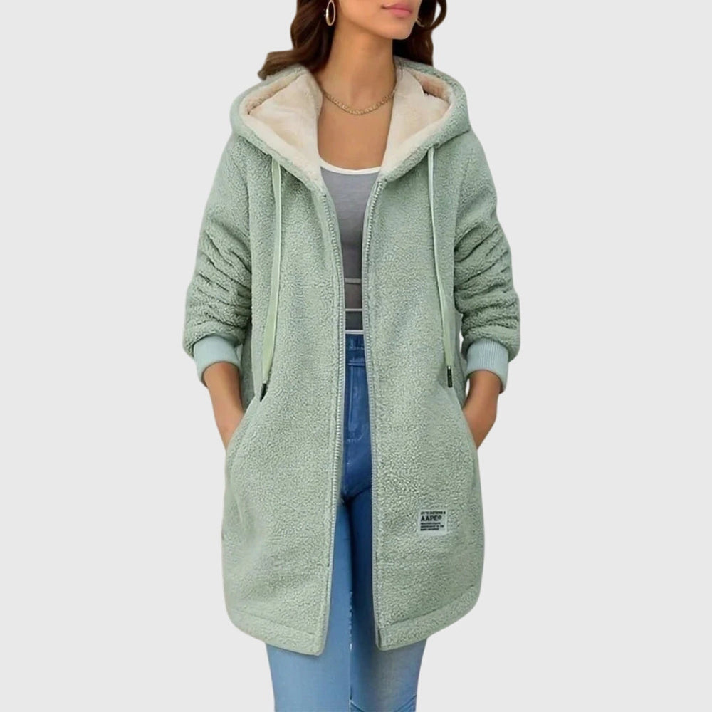 Zacht lang dames knuffeljack met capuchon en rits in blauw, groen, bruin of roze, ideaal voor casual wintermode.