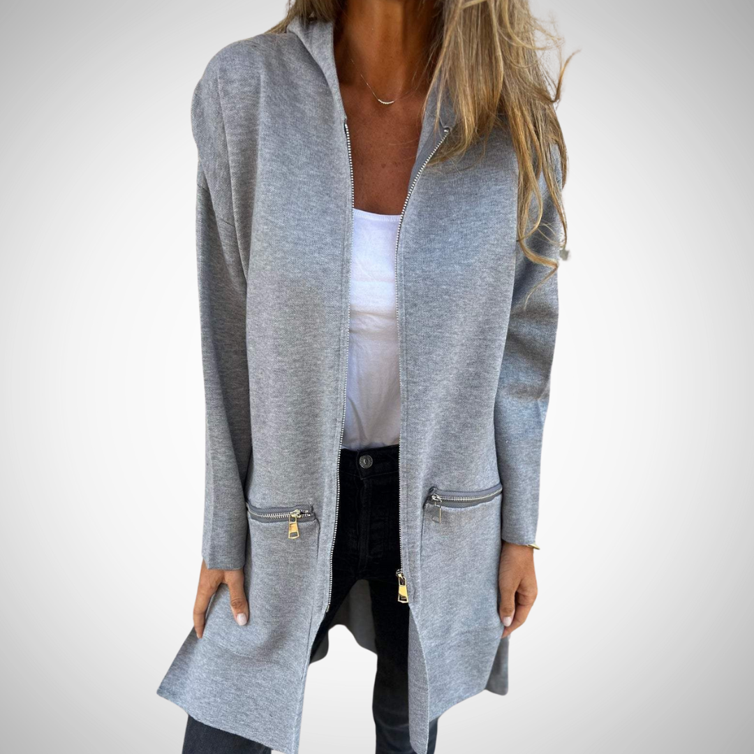 Elegant lang dames vest met capuchon en praktische zakken, een must-have voor herfst- en winterdagen.