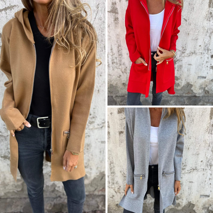 Zacht gebreid lang dames vest met capuchon in tijdloze kleur, casual en warm, ideaal voor koudere dagen.