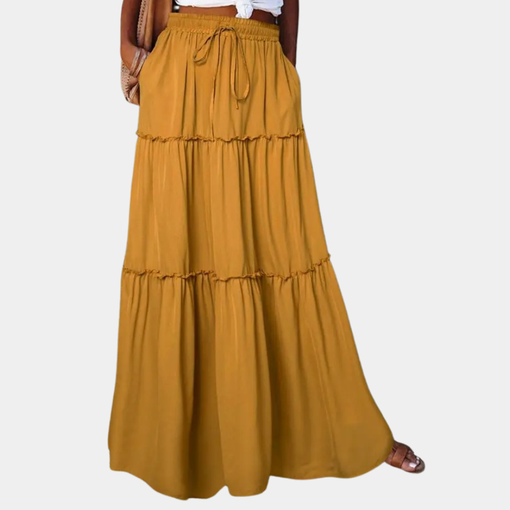 Stijlvolle multicolor lange rok met vloeiende pasvorm. Trendy dames zomer rok, perfect voor een bohemian look.