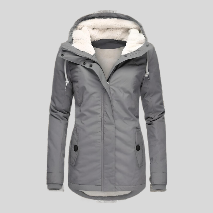Lange dames winterjas, waterdicht, met warme voering en capuchon. Ideaal voor stijlvolle bescherming tegen de kou.