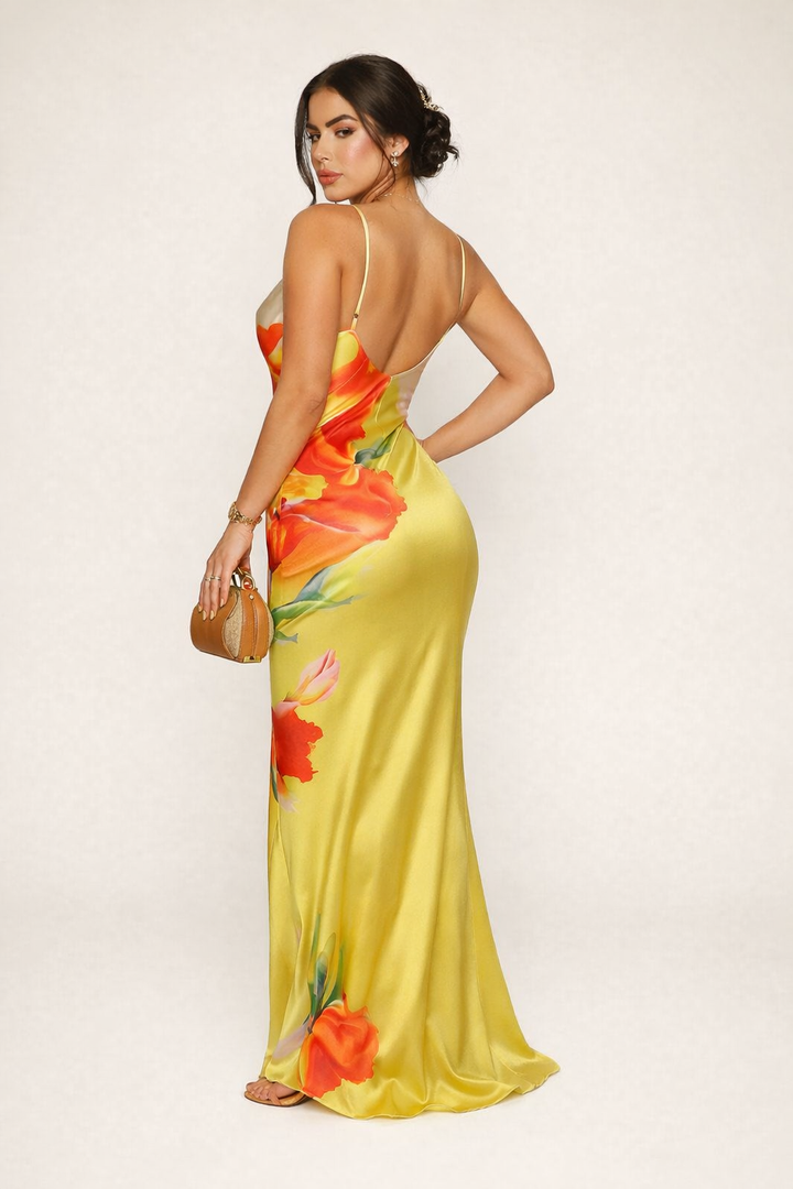 Elegante maxi-jurk voor dames met kleurrijke bloemenprint en fijne bandjes; ideaal voor feesten.