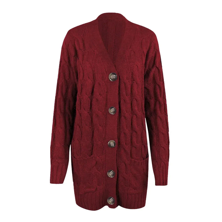 "Lange gebreide damescardigan in zachte stof met knoopsluiting en zakken, ideaal voor casual lente looks."