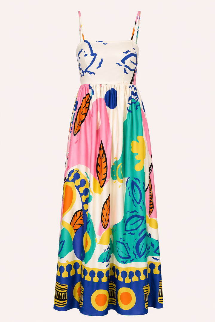 Moderne dames zomerjurk met frisse grafische print, vloeiende pasvorm en verstelbare spaghetti bandjes. Essentieel voor warm weer.