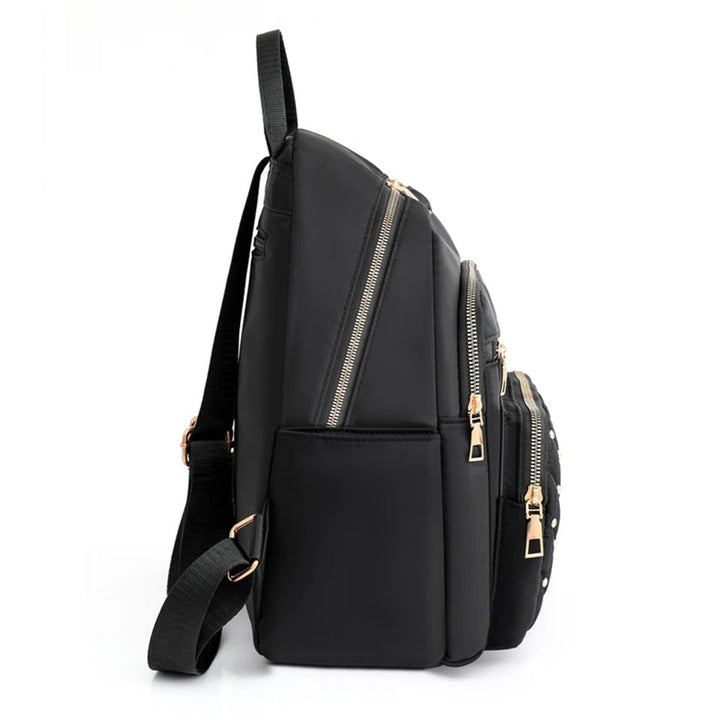 Veelzijdige waterdichte dames rugzak van nylon met interne organiser, perfect voor school & werk.