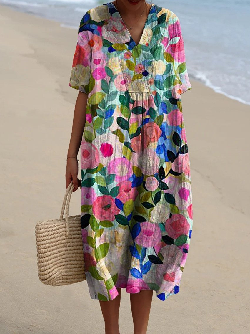 Luchtige dames bloemenjurk met flatterende pasvorm, perfect voor zomer en strand.