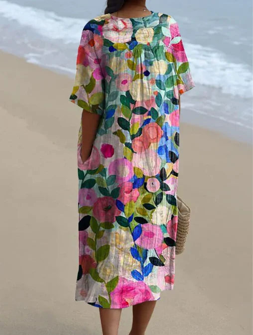 Comfortabele midi bloemenjurk voor dames, ideaal als casual zomer- of strandjurk.