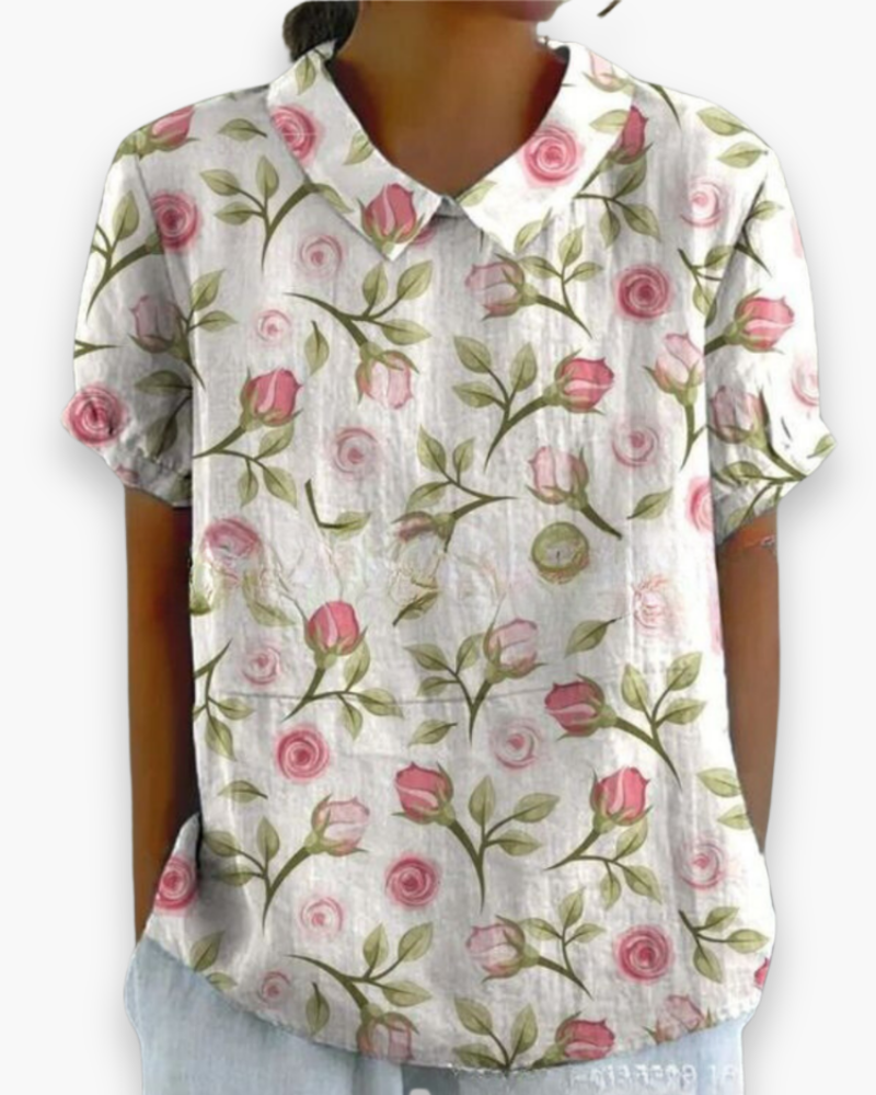 Luchtige, losvallende damesbloes met bloemenprint, modieus en comfortabel voor je vakantie outfit.