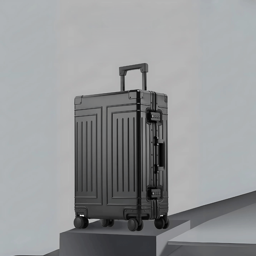 Stille, soepele zilveren aluminium reiskoffer met 360° wielen voor comfortabel en elegant reizen.