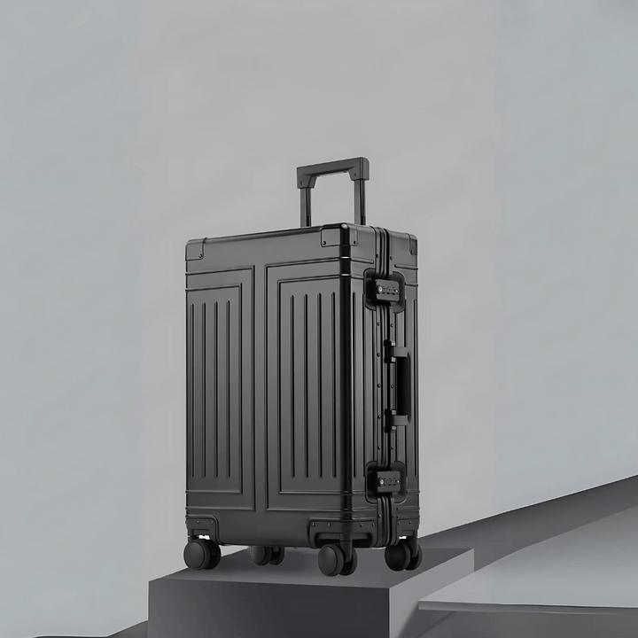 Stille, soepele zilveren aluminium reiskoffer met 360° wielen voor comfortabel en elegant reizen.