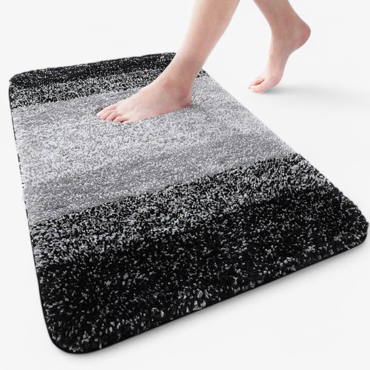 Praktische sneldrogende badmat, eenvoudig wasbaar voor optimale hygiëne; zachte microvezel biedt comfort.