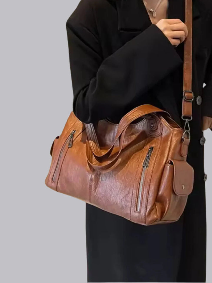 Veelzijdige zwarte dames schoudertas; een praktische tas voor werk, school of dagelijkse boodschappen.