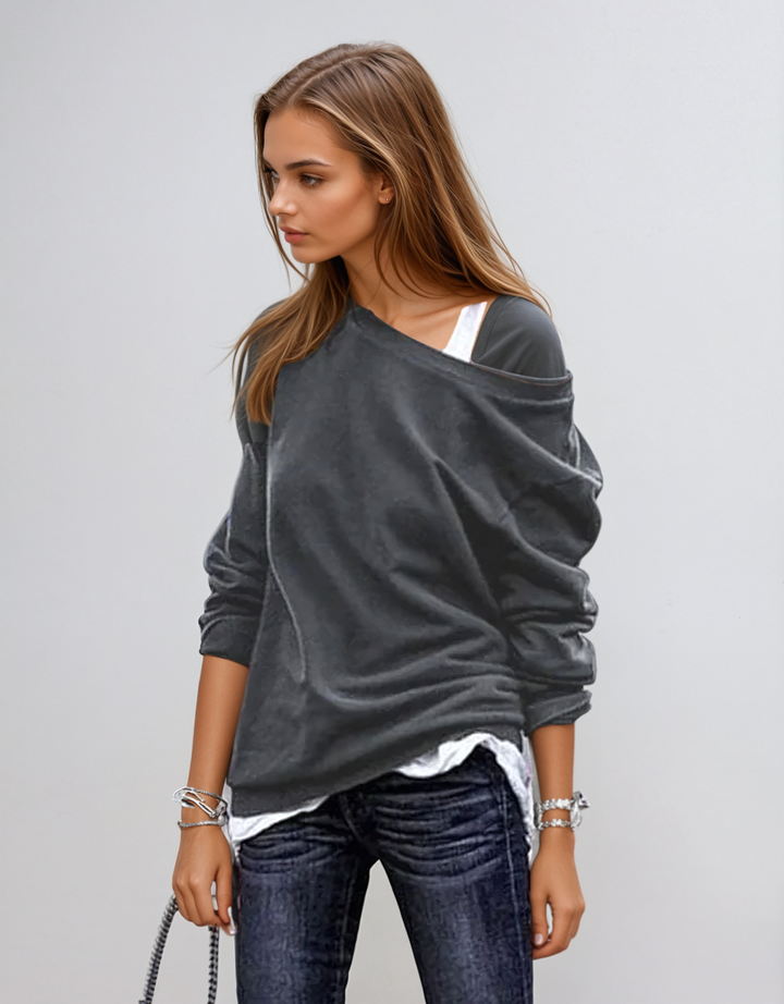Modieuze asymmetrische damestrui met lange mouwen, perfect voor herfst- en wintermode. Stijlvol comfortabel.