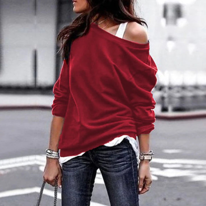 Stijlvolle asymmetrische damestrui met lange mouw, perfect voor een casual maar modieuze look.