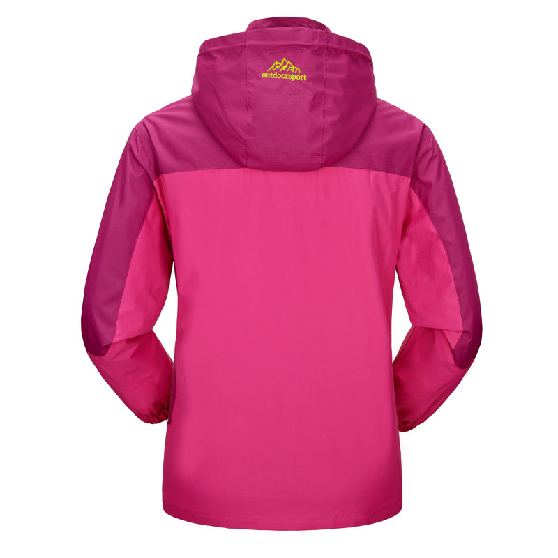 Roze dames waterdichte winterjas met warme voering en capuchon, perfect voor stijlvolle bescherming tegen wind en regen.