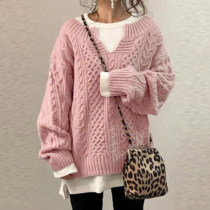 Losvallende gebreide damestrui met lange mouwen. Deze comfortabele en modieuze dames trui is perfect voor de winter.