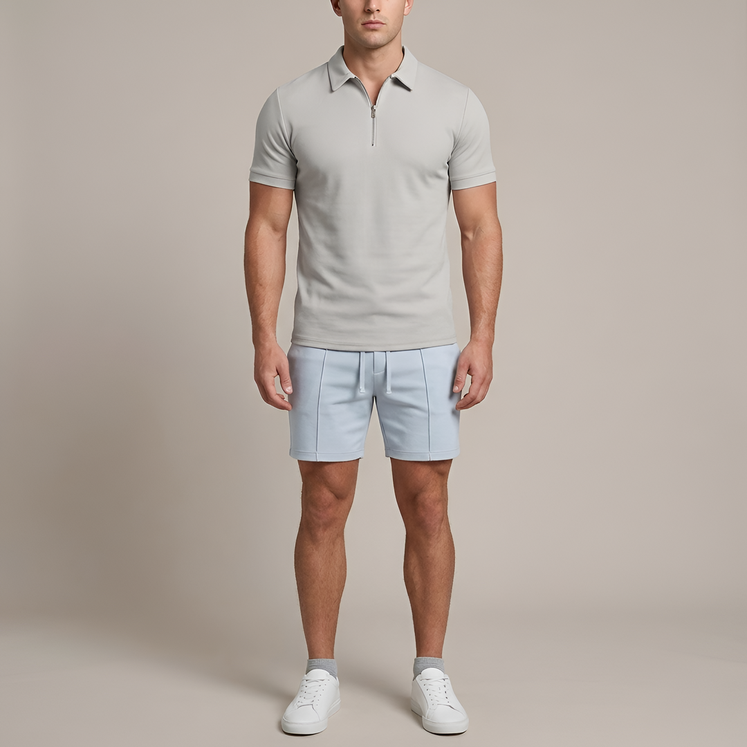 Ademende herenpolo met rits, korte mouw en slim fit pasvorm, ideaal voor warme zomerdagen.