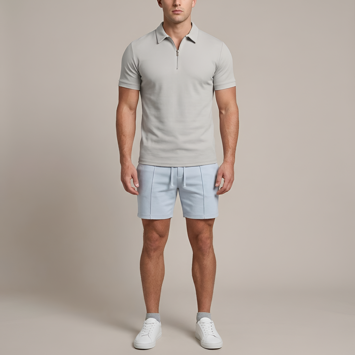 Ademende herenpolo met rits, korte mouw en slim fit pasvorm, ideaal voor warme zomerdagen.